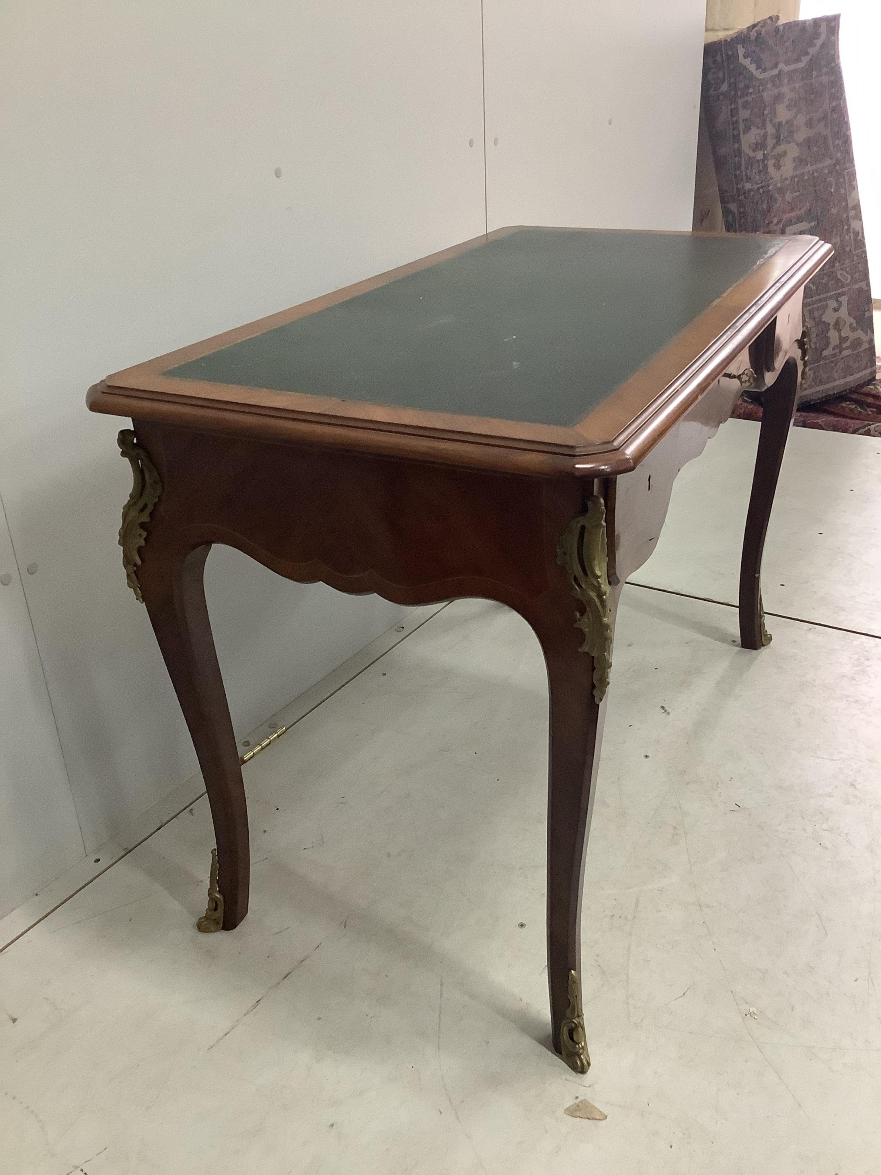 A French gilt metal mounted kingwood bureau plat, width 113cm, depth 60cm, height 77cm. Condition - fair, pieces of corner moulding are missing